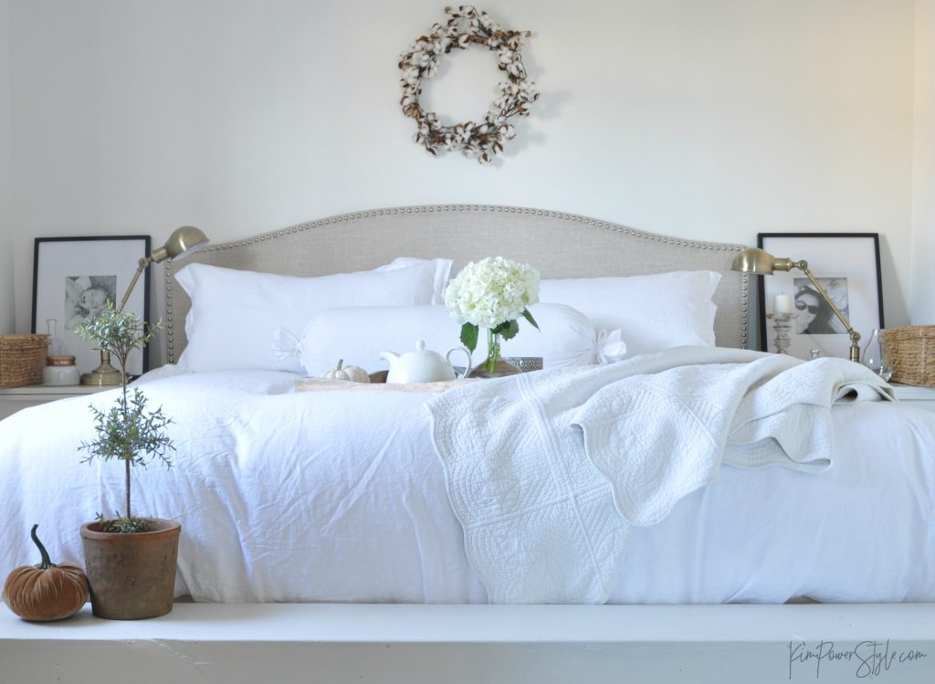 Comfy bedroom decorated for fall.