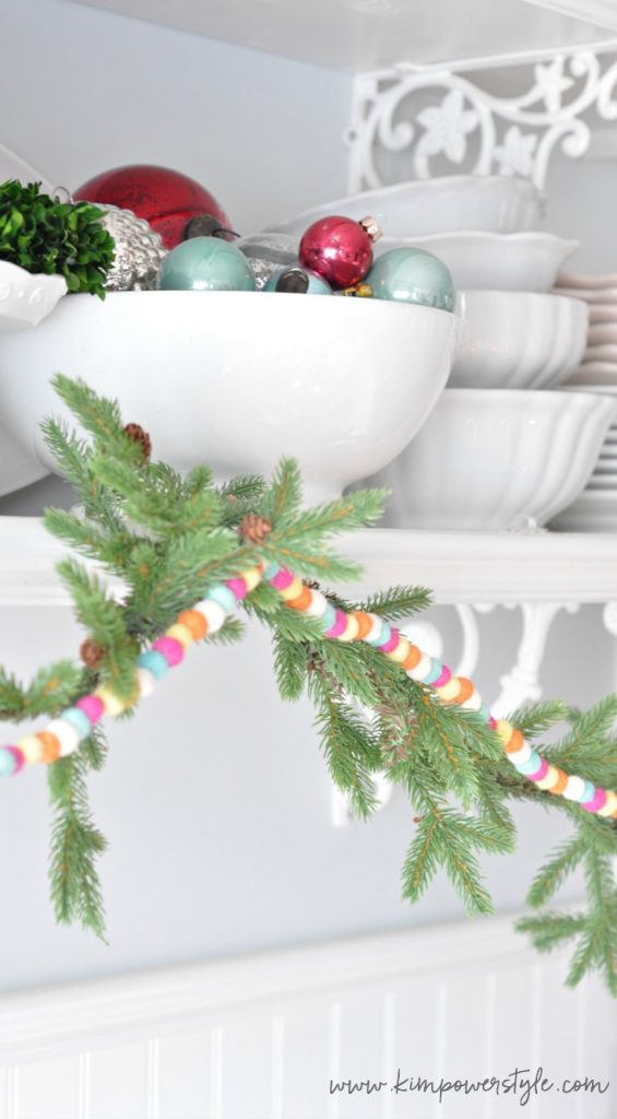  Bowl full of ornaments and felt ball garland