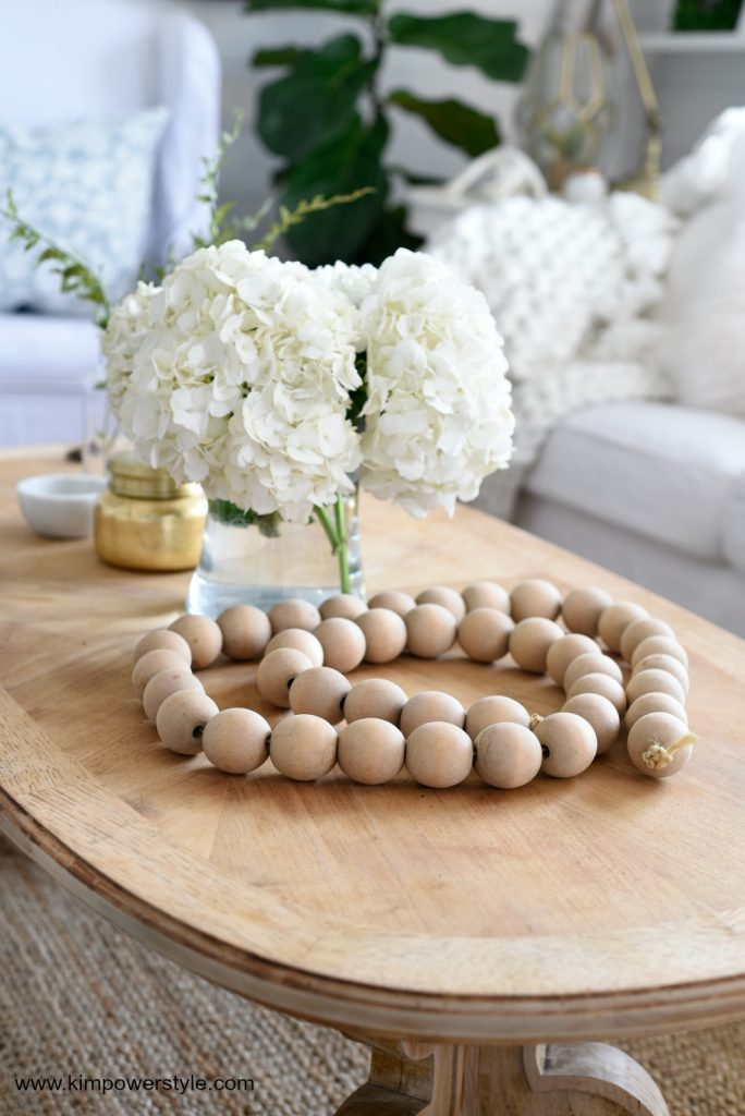 Beautiful wooden beaded garland makes a great coffee table accent.