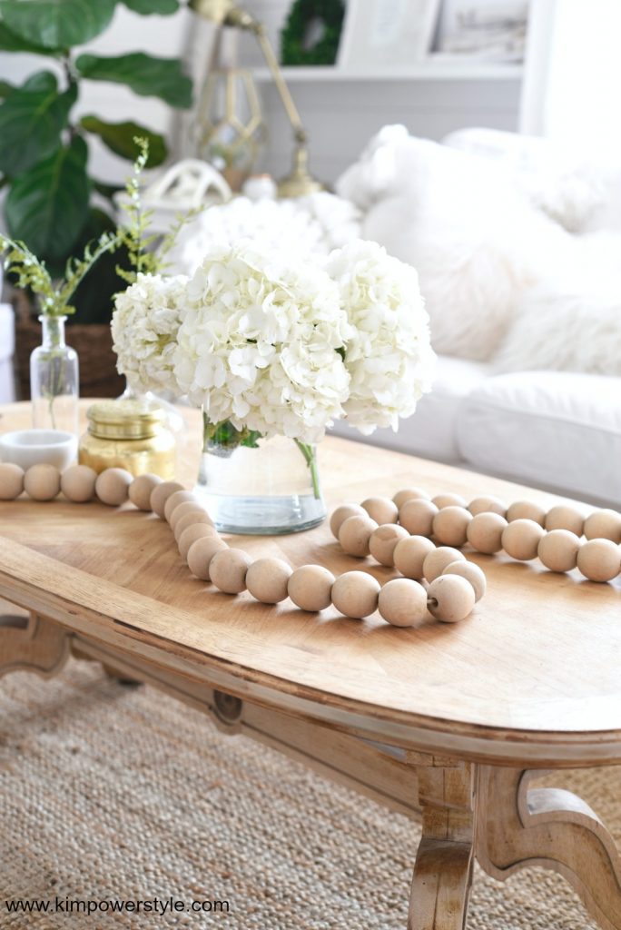 Wooden bead garland as a coffee table accent.