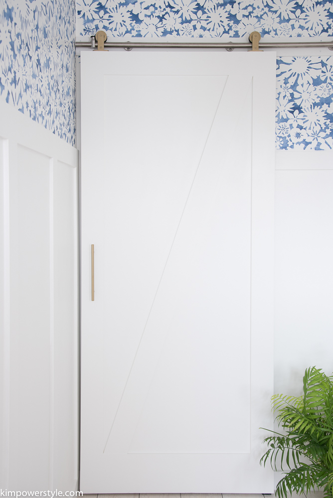 A modern barn door with brass hardware