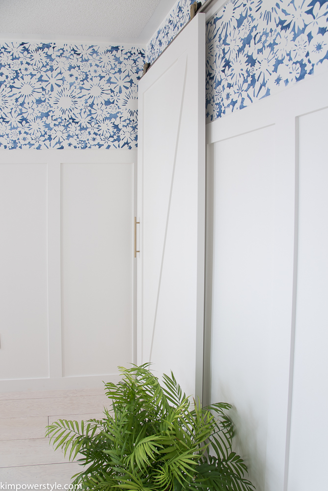 A modern barn door with brass hardware